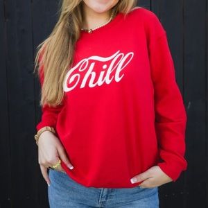 Suburban riot. Size small. Red “chill” sweater. New without tags